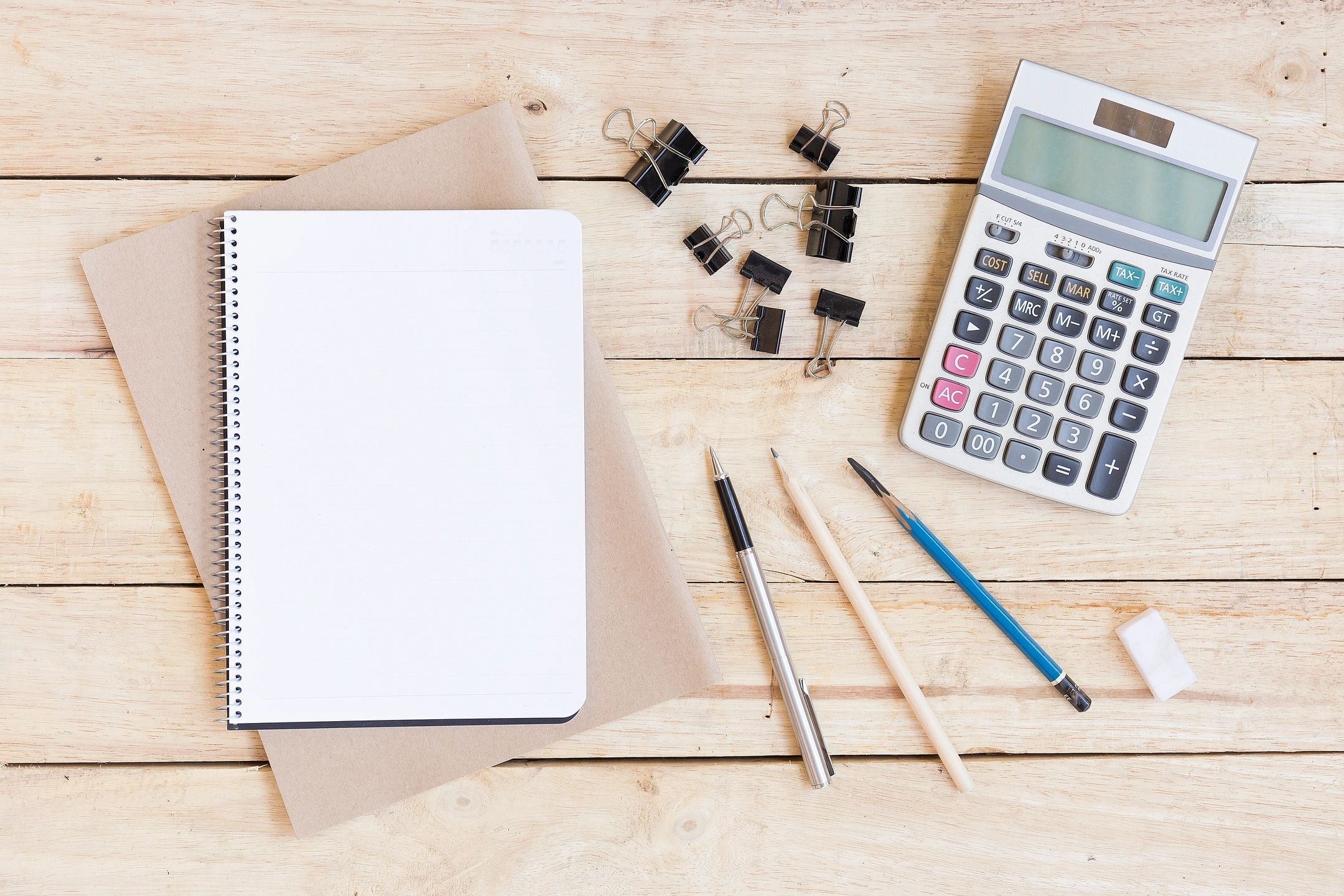 Office workspace with notebook and calculator